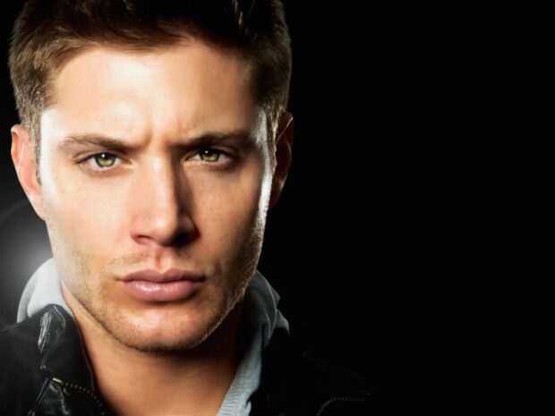 Close up of Dean Winchester with intense eyes and slight stubble on face