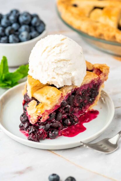 A slice of pie filled with blueberries topped with vanilla ice cream, HD Mobile Wallpaper