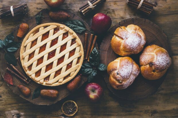 A lattice top pie surrounded by cinnamon sticks and fresh apples on a wooden table, HD Desktop Wallpaper