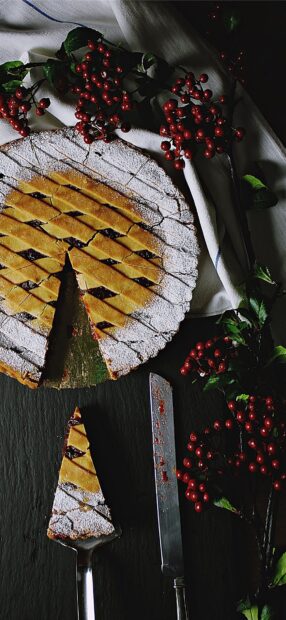 A slice of pie with powdered sugar and red berries on a dark surface, HD Phone Wallpaper