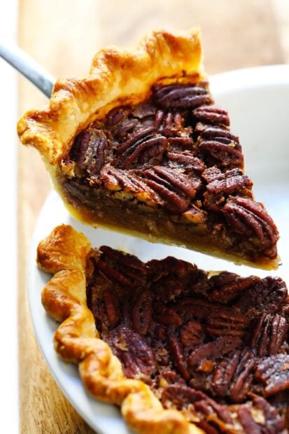 A pecan pie slice topped with whole nuts on a plate, HD Mobile Wallpaper