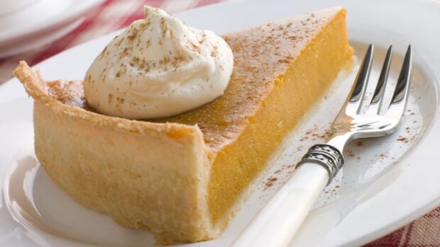 A delicious slice of pie topped with whipped cream and a sprinkle of cinnamon, HD Mobile Wallpaper
