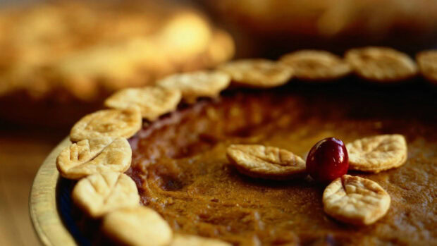 A close up of a spiced pie with decorative crust and cherry on top, HD Desktop Wallpaper