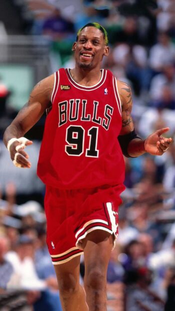 Dennis Rodman in red Bulls jersey celebrating during an NBA Finals game