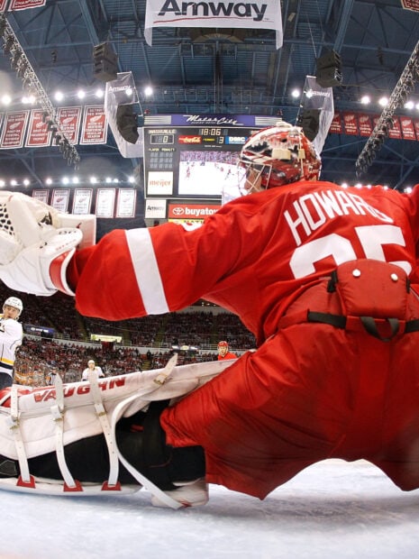 Detroit Red Wings goalie making a save during a hockey game at home arena