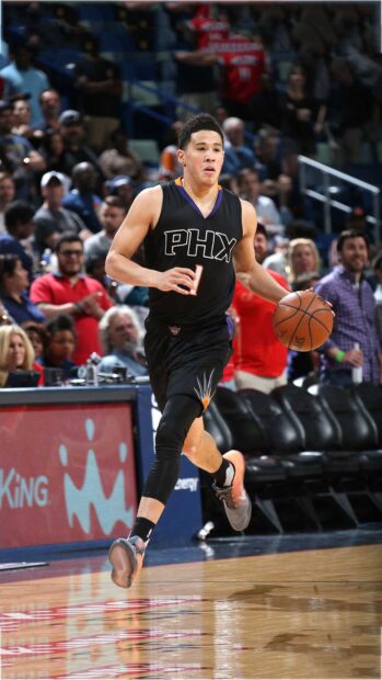 Devin Booker dribbling the basketball during a game in black PHX uniform, HD Phone Wallpaper