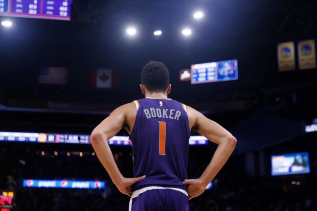 Devin Booker stands with hands on hips during the game, HD Desktop Wallpaper