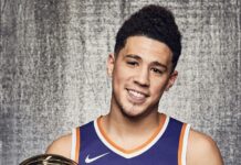Devin Booker holding his NBA 3 point contest trophy with a smile, HD Desktop Wallpaper