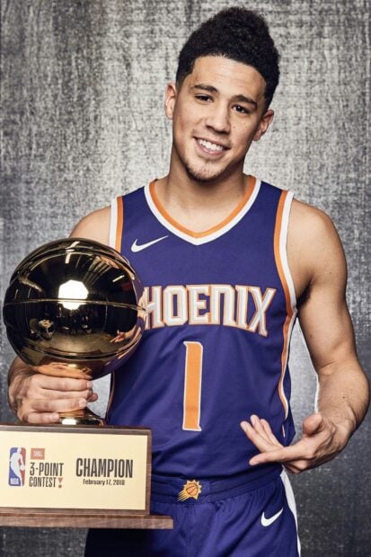 Devin Booker holding his NBA 3 point contest trophy with a smile, HD Desktop Wallpaper
