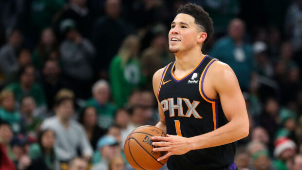 Devin Booker dribbling the ball on court in a Phoenix Suns uniform, HD Desktop Wallpaper