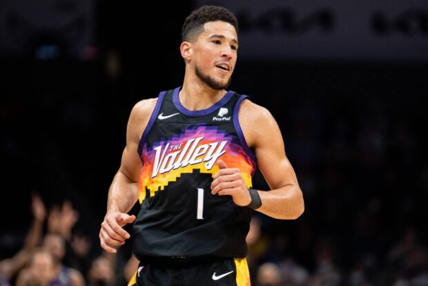 Devin Booker is shown playing basketball during a game, 2K Desktop Wallpaper