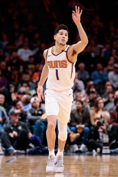 Devin Booker shoots a basketball in a Suns uniform on court, 2K Mobile Wallpaper