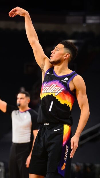 Devin Booker is focused while shooting a basketball during the game, HD Mobile Wallpaper