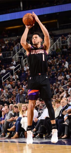 Devin Booker Wallpapers showing a player shooting a basketball in a Suns uniform during a game, 2K Mobile Wallpaper