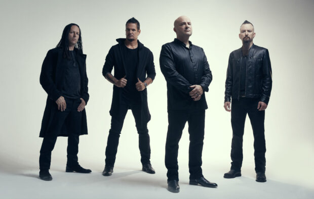 The members of Disturbed stand confidently in black clothing against a light background, HD Desktop Wallpaper