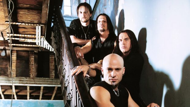 The band Disturbed poses together on a rustic staircase with serious expressions, HD Desktop Wallpaper