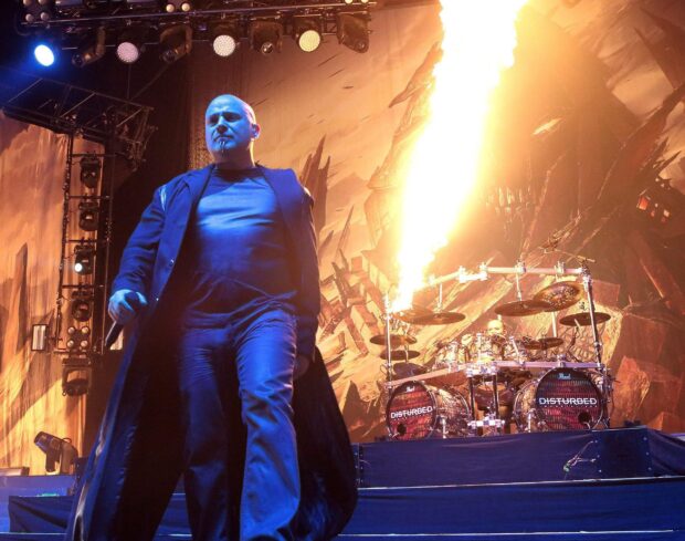 The band Disturbed delivers a powerful stage performance with fire effects and dynamic energy, HD Desktop Wallpaper
