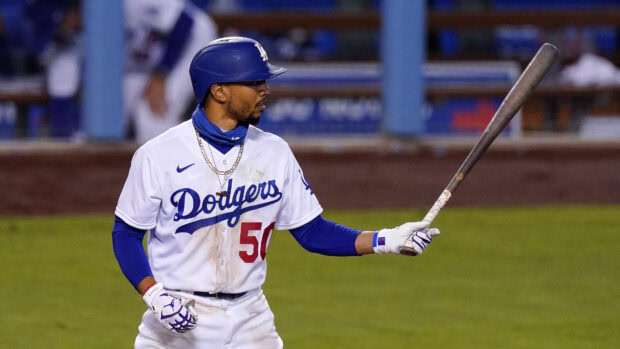 A Dodgers player holds a bat while preparing to bat in a Major League Baseball game, 4K Desktop Wallpaper
