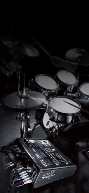 A drummer is playing an electronic drum set with various components and audio equipment, HD Mobile Wallpaper