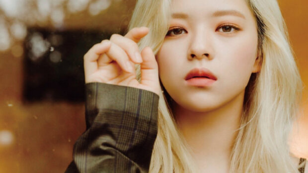A close up portrait captures Jeongyeon Twice with a thoughtful expression, HD Desktop Wallpaper
