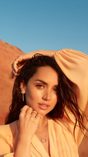 Ana De Armas poses outdoors with jewelry and soft natural light, 4K Mobile Wallpaper