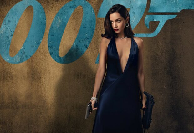 A woman dressed elegantly holds guns with a confident gaze in No Time To Die wallpapers, HD Desktop Wallpaper