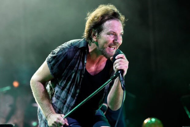 The Pearl Jam vocalist passionately sings into the microphone during a live performance, HD Desktop Wallpaper