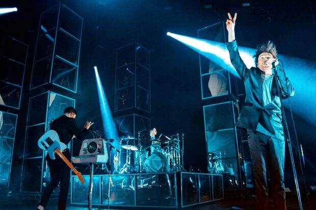 Enter Shikari band performing on stage with vibrant blue lights, 2K Desktop Wallpaper