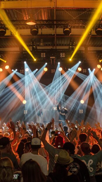A lively crowd enjoys the vibrant lights and music in a nightclub setting, HD Mobile Wallpaper