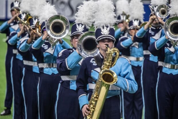 A marching band playing brass instruments in coordinated formation, HD Desktop Wallpaper