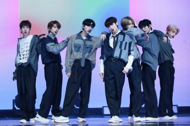 Enhypen wallpapers show the group posing on stage with colorful lights, HD Desktop Wallpaper