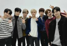 The Enhypen members show hand signs and pose for a group photo in casual outfits, HD Desktop Wallpaper