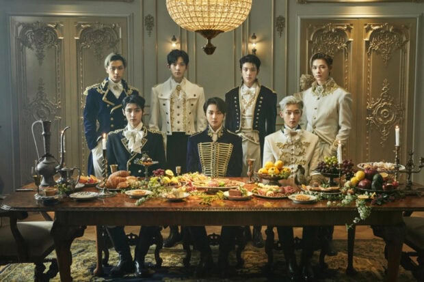 Enhypen Wallpapers show the members dressed in ornate clothing around a banquet table, HD Desktop Wallpaper