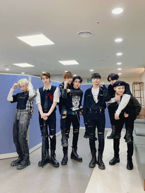 The members of Enhypen stand together in a room wearing black outfits, HD Mobile Wallpaper