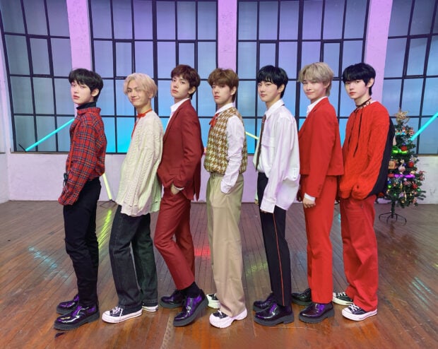 The group Enhypen poses in stylish colorful clothes indoors, HD Desktop Wallpaper