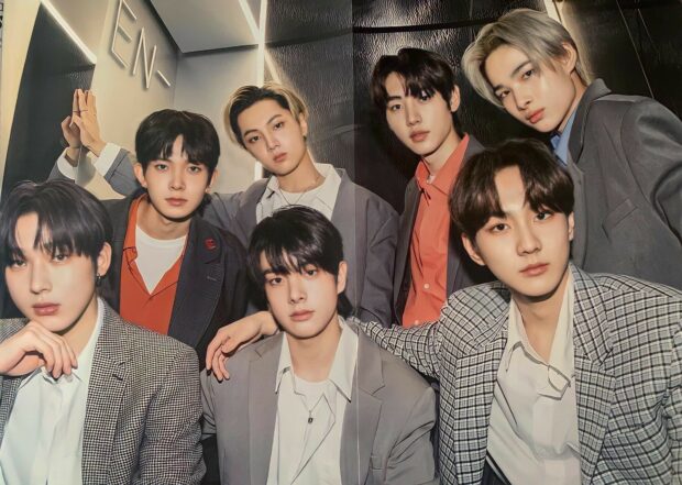 The seven members of Enhypen are posing together in stylish suits, HD Desktop Wallpaper