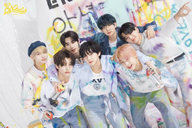 Enhypen group posing with vibrant paint splashes on clothes and background, HD Desktop Wallpaper