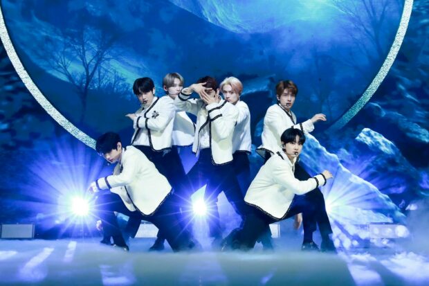 Enhypen Wallpapers showcases a dynamic stage performance with synchronized dance moves, HD Desktop Wallpaper