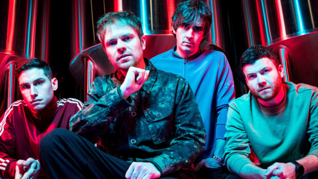 The Enter Shikari band members pose together with colorful lighting, HD Desktop Wallpaper