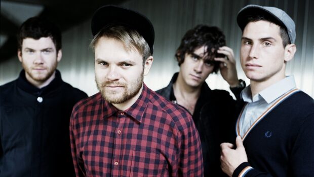 The Enter Shikari band is posing for a group portrait indoors, HD Desktop Wallpaper