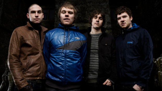 The Enter Shikari band stands together outdoors in casual jackets, HD Desktop Wallpaper