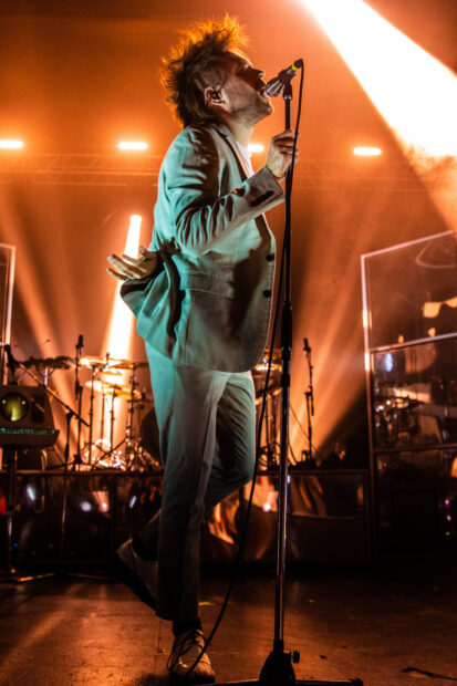 The Enter Shikari band lead singer performs passionately on stage, HD Mobile Wallpaper