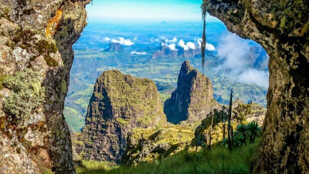 A stunning view of Ethiopia's mountain formations and lush greenery under a clear blue sky, HD Desktop Wallpaper