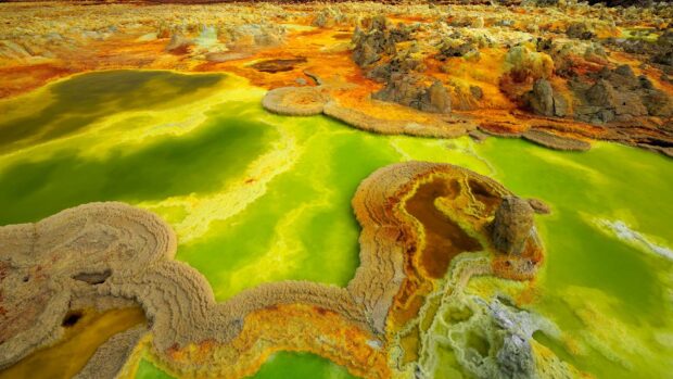 The Ethiopia landscape shows vivid green and orange mineral pools and formations, HD Desktop Wallpaper