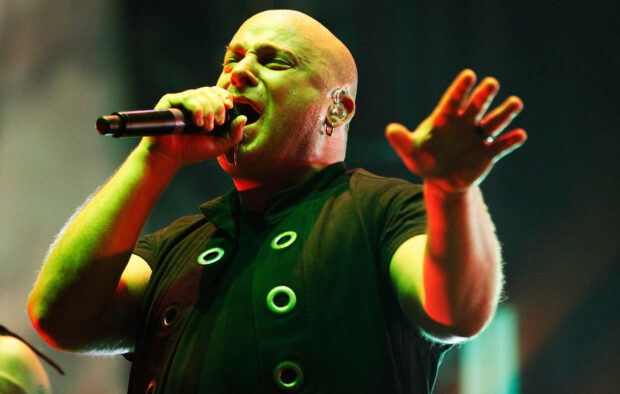 The singer is captured mid performance with emotion and a microphone, HD Desktop Wallpaper