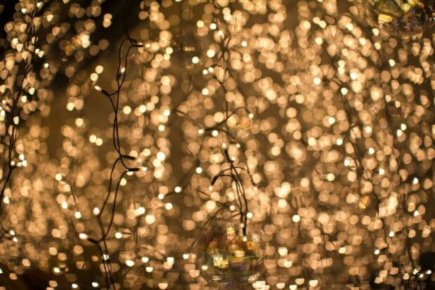 Warm fairy lights glowing softly in a blurred background creating a magical atmosphere