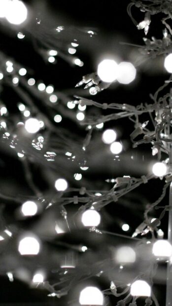 Close up of fairy lights glowing softly in the dark with blurred light effects