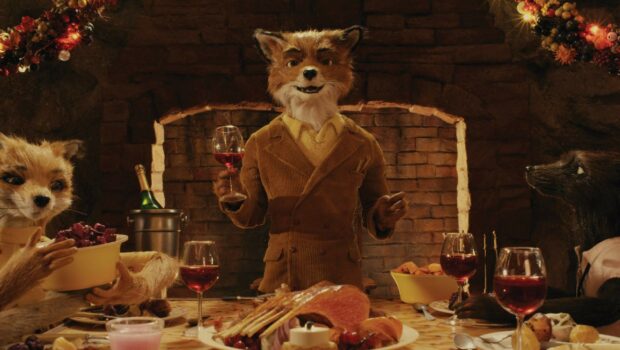 A scene with Fantastic Mr Fox holding a glass of wine at a festive dinner table
