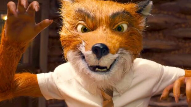 Close up of Fantastic Mr Fox character showing a mischievous smile and raised paw