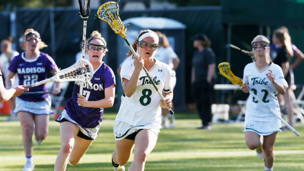 Female lacrosse players compete intensely during a game with focused determination, HD Desktop Wallpaper